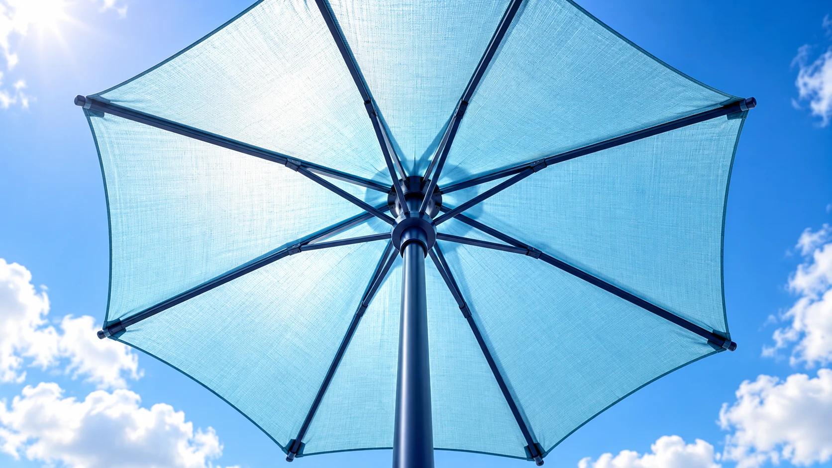 Pale cyan patio umbrella viewed from below, showing fabric texture and supporting ribs.